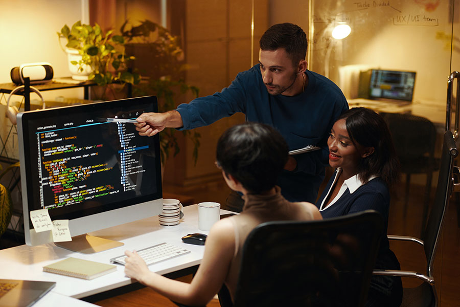 A team is going over the code to ensure it is functional and secure.